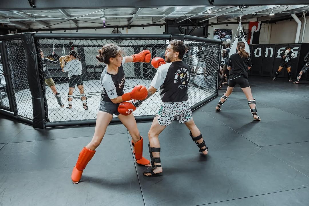 Ana Arvan landing a jab during cage sparring