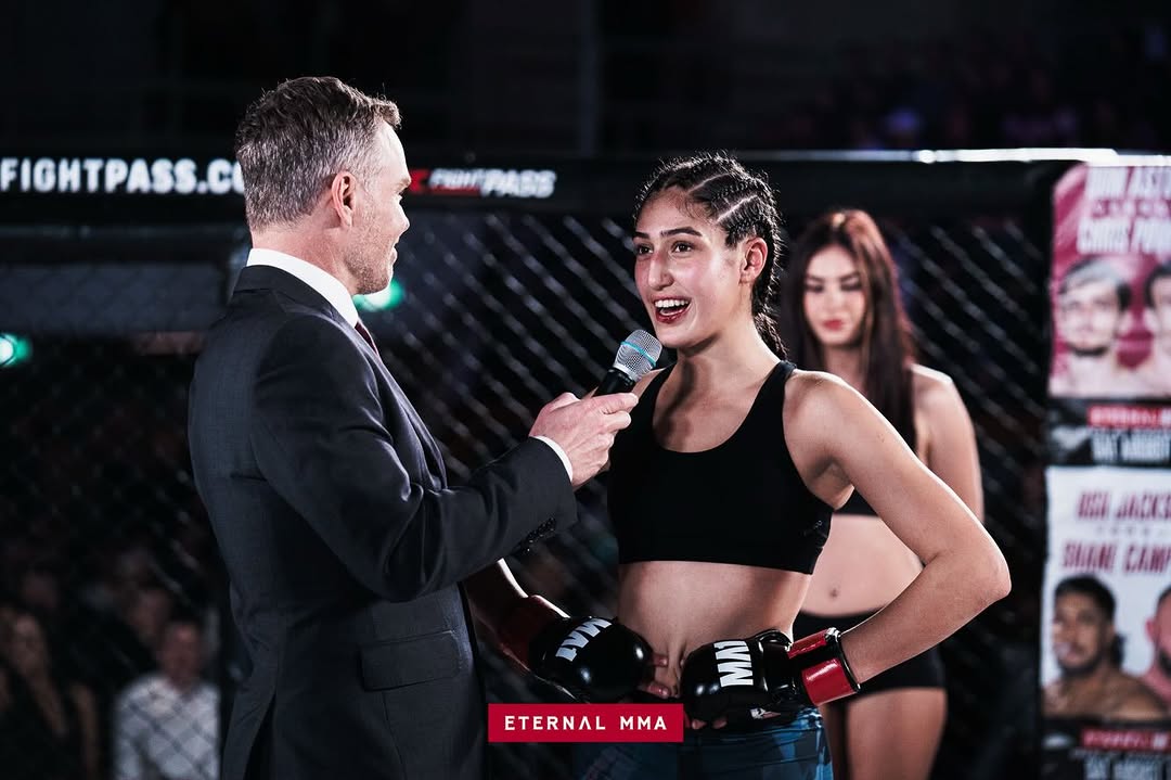 Ana Arvan being interviewed in the cage after her win at Eternal MMA 107